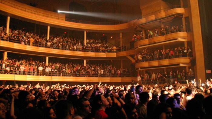 People sit in theatre seats at Hammerstein Ballroom in the Manhattan Center in New York City.