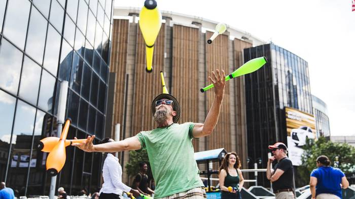 A man juggles in Midtown Manhattan