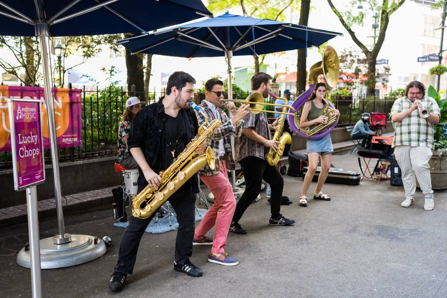 Members of a brass band play outside in Greeley Square Park in Midtown Manhattan.