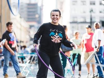 woman with hula hoop outdoors