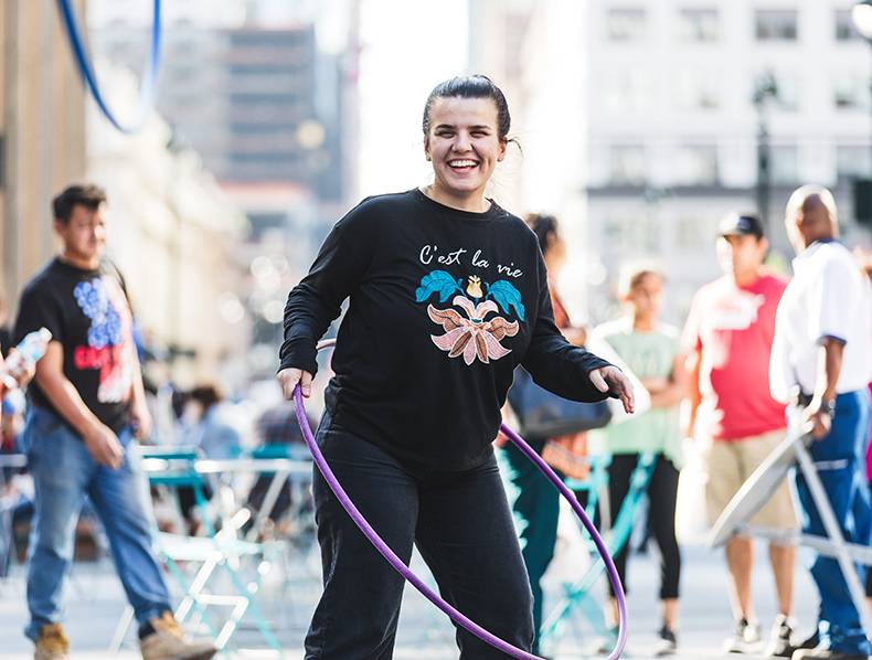 woman with hula hoop outdoors