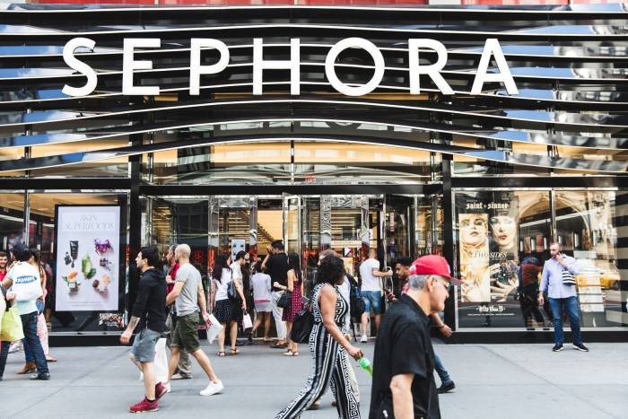 People walk on the sidewalk in front of the Sephora on 34th Street in New York City.