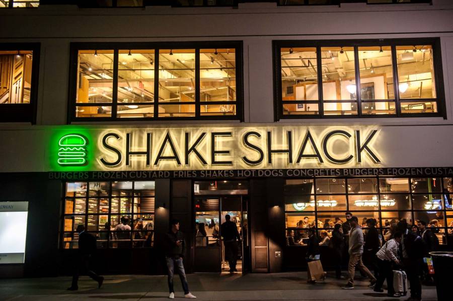 People walking in front of Shake Shack in New York City