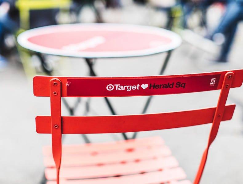 A chair in Herald Square Plaza is branded by Target.